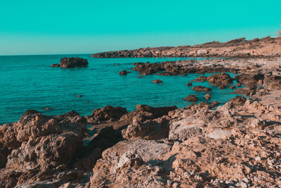 Scenic view of sea against clear blue sky