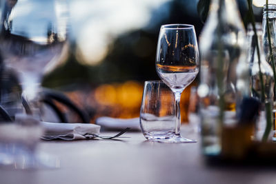 Luxury table settings for fine dining with and glassware, pouring wine to glass. 