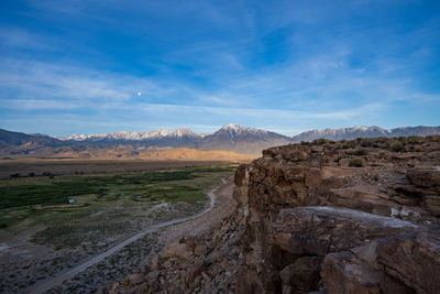 Owens river valley cliff view distant snowy peaks of eastern sierra nevada mountains california usa