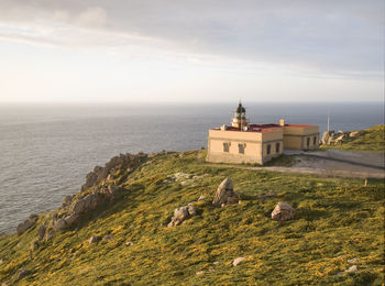 Scenic view of sea and buildings against sky