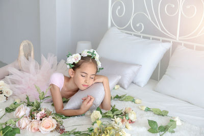 Young woman lying down on sofa