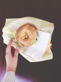 Close-up of hand holding burger