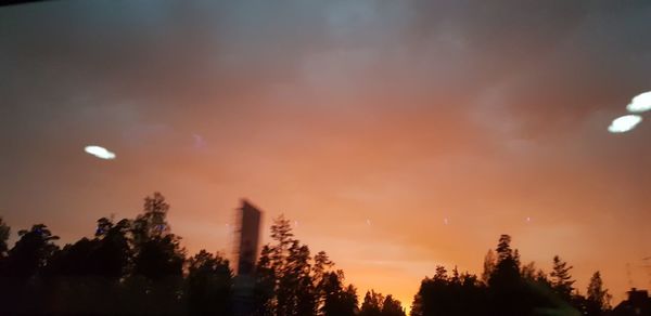 Low angle view of silhouette trees against sky during sunset