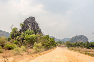 Country road leading towards mountains