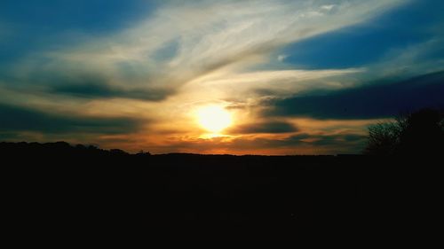 Scenic view of silhouette landscape against sky during sunset