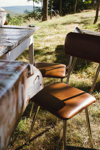 High angle view of empty bench on field