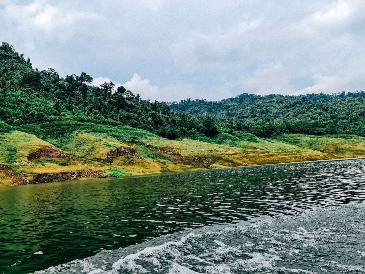 SCENIC VIEW OF RIVER FLOWING AGAINST SKY