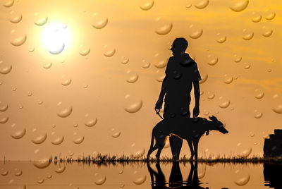 Silhouette person seen through wet glass window during rainy season