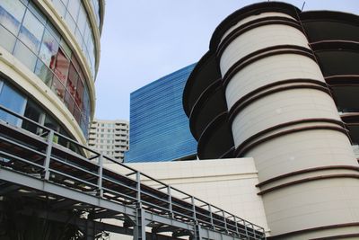 Low angle view of modern buildings against clear blue sky