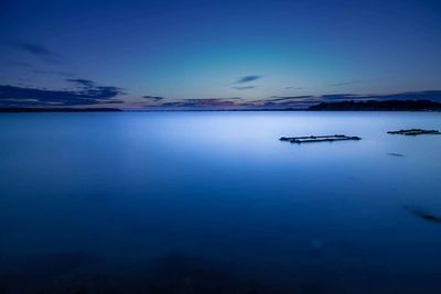 Scenic view of calm lake against mountain range