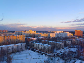 Cityscape against sky during sunset