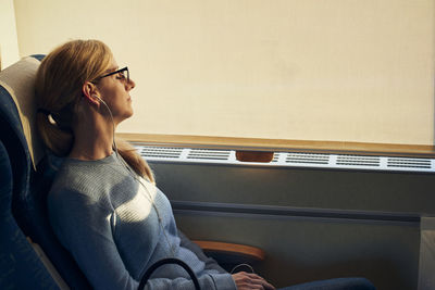 Woman relaxing in train