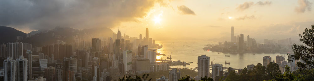Panoramic view of buildings against sky during sunset