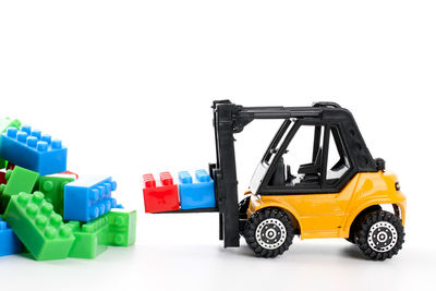 Toy car against white background