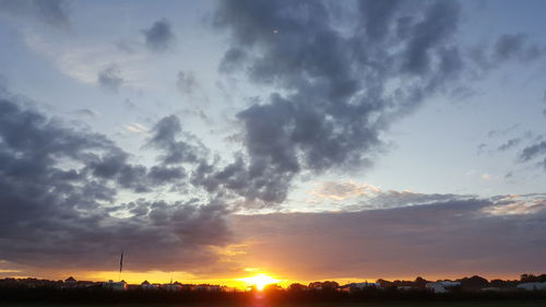 Low angle view of dramatic sky during sunset