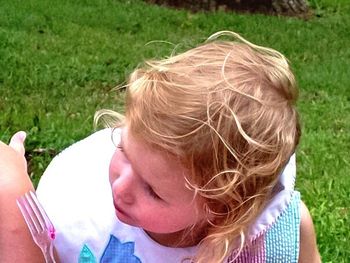 Girl standing on grass in park