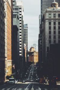 City street amidst buildings against sky