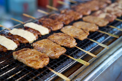 Close-up of meat on barbecue grill