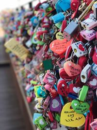 Close-up of padlocks hanging on railing