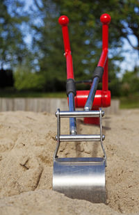 A new toy excavator in the sandbox