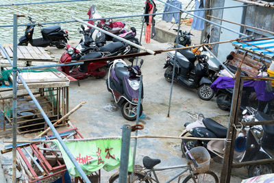 High angle view of bicycles on railing in city