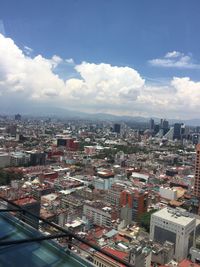 High angle view of city buildings against sky