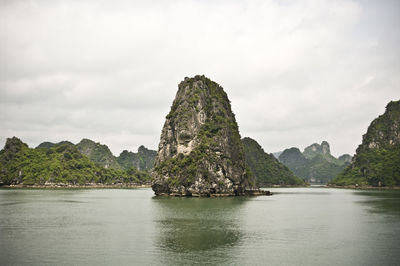 Scenic view of mountains against cloudy sky