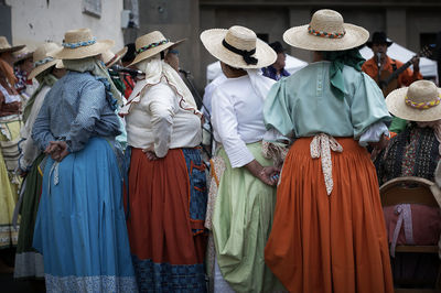 Rear view of women standing in market