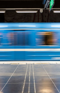 Blurred motion of train at railroad station platform