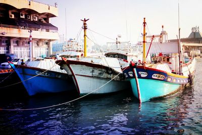 Boats moored at harbor