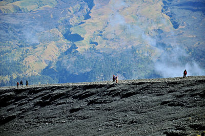 Mid distance view of people against mountains