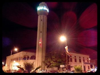 Low angle view of illuminated building at night