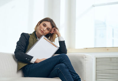 Portrait of businesswoman sitting of sofa