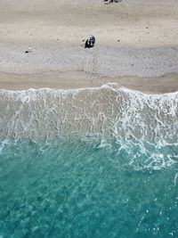 High angle view of surf on beach