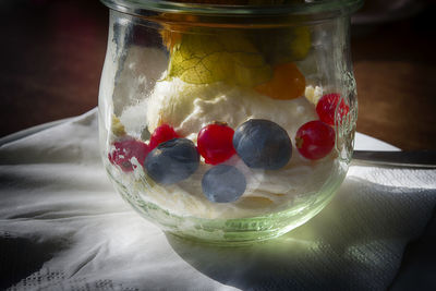 Close-up of fruits in glass jar on table