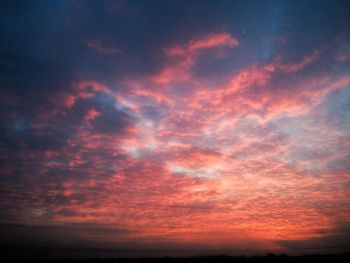 Low angle view of dramatic sky during sunset