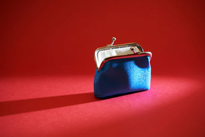 Close-up of vintage car on table against red background