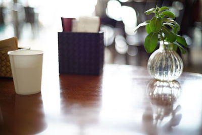 Close-up of glass of vase on table