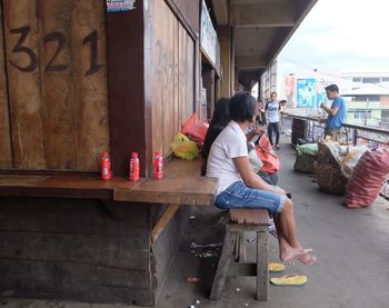 Woman sitting on a road