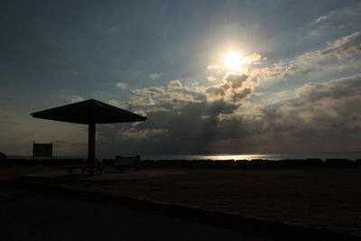 Scenic view of beach against sky during sunset
