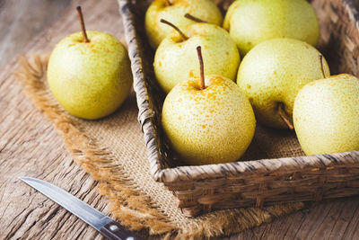 High angle view of fruits in basket on table