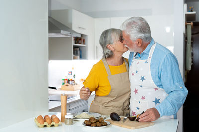 Portrait of senior man preparing food at home