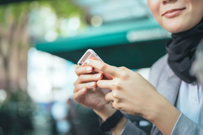 Close-up of man using mobile phone