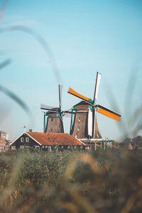 Low angle view of windmill against sky