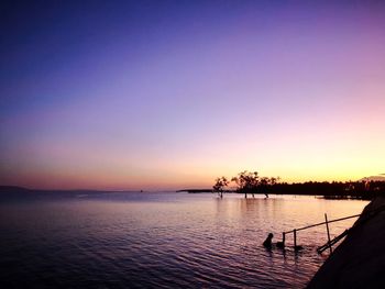 Scenic view of sea against clear sky during sunset