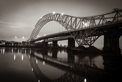 View of bridge over river mersey at night.