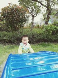 Portrait of smiling boy in park