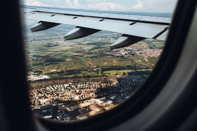 Aerial view of landscape seen through airplane window