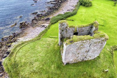 High angle view of old stone on beach