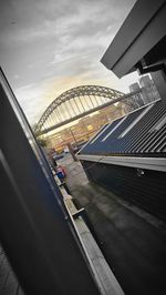 Bridge against sky in city